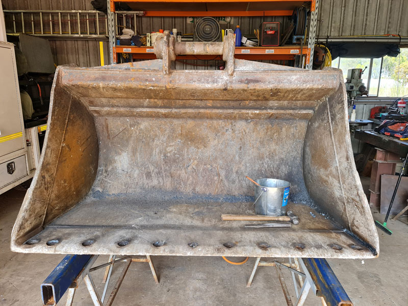 Before Excavator bucket cutting edge replacement