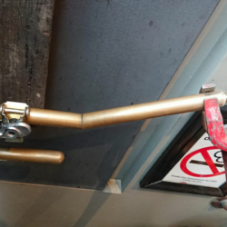 Brass handrail repair onsite 1