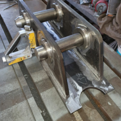 Excavator mounting plate being fabricated